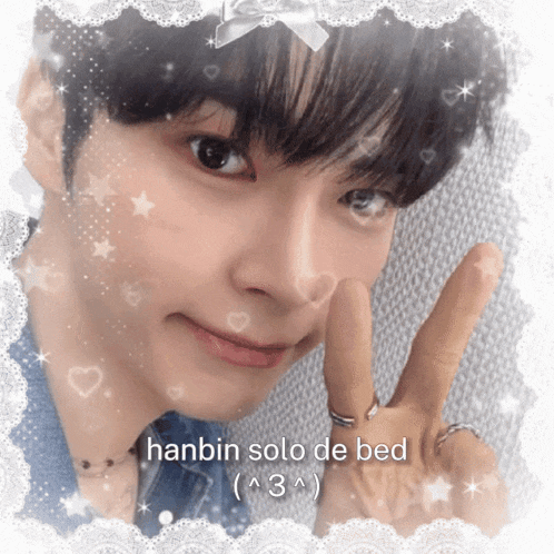 a picture of a young man with the words hanbin solo de bed above him