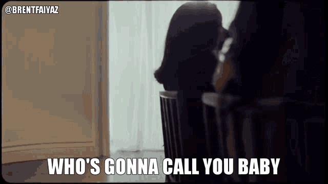 a woman sitting in a chair with the words who 's gonna call you baby