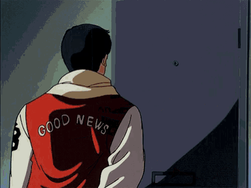a man wearing a good news jacket is standing in front of a woman