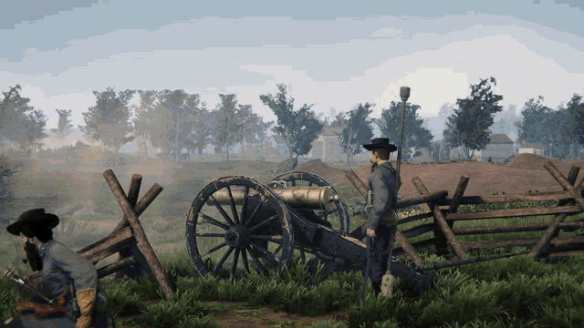 a man in a cowboy hat stands in front of a cannon in a field