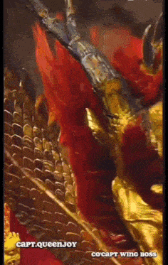 a close up of a painting of a dragon with the caption cocapt wing boss .