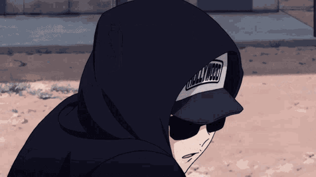 a person wearing a hooded jacket and a hat that says hollywood