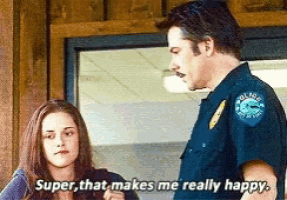 a man in a police uniform is standing next to a woman who says super that makes me really happy
