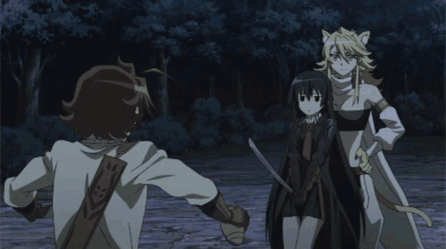 a man holding a sword stands next to a woman with cat ears