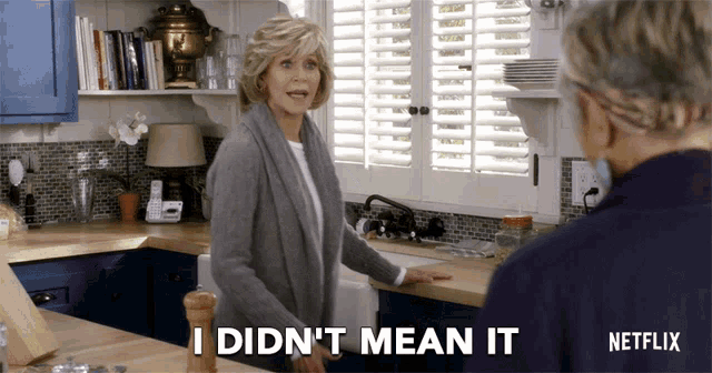 a woman in a kitchen says " i didn t mean it "