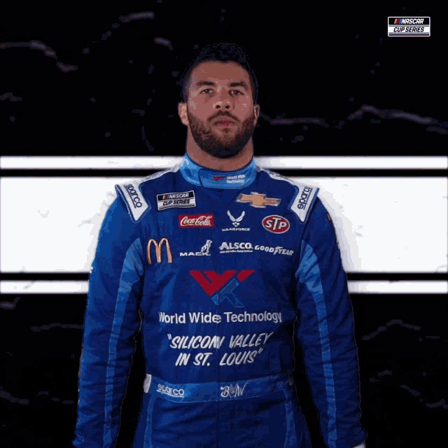 a man wearing a blue racing suit that says silicon valley in st. louis on it