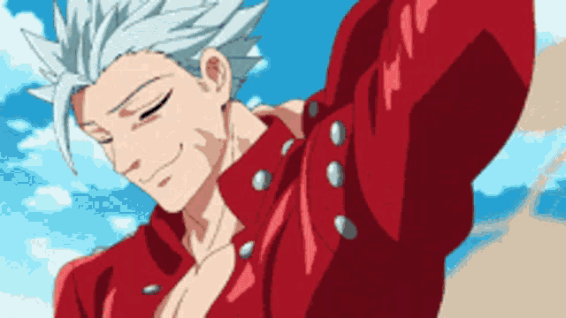 a man with white hair is wearing a red jacket and smiling