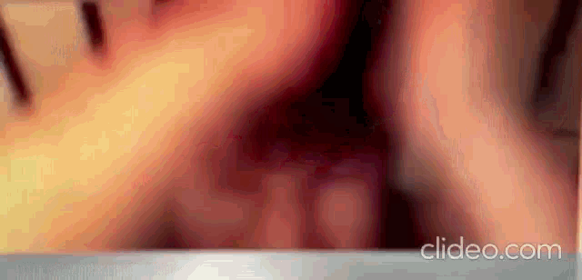 a close up of a person 's face with a blurred background and the words cleido.com on the bottom .