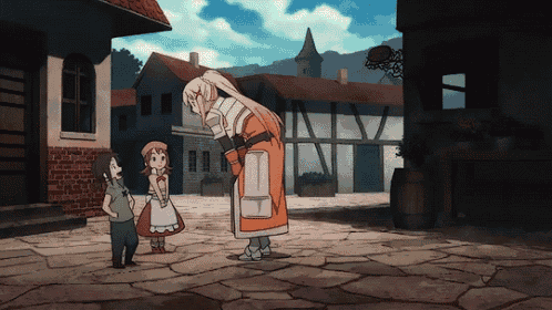 a woman in a knight 's armor is talking to two children in a village