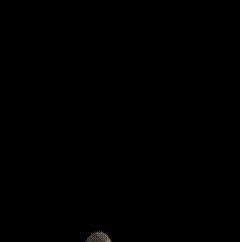 a blurred image of a person 's face with a flame coming out of it