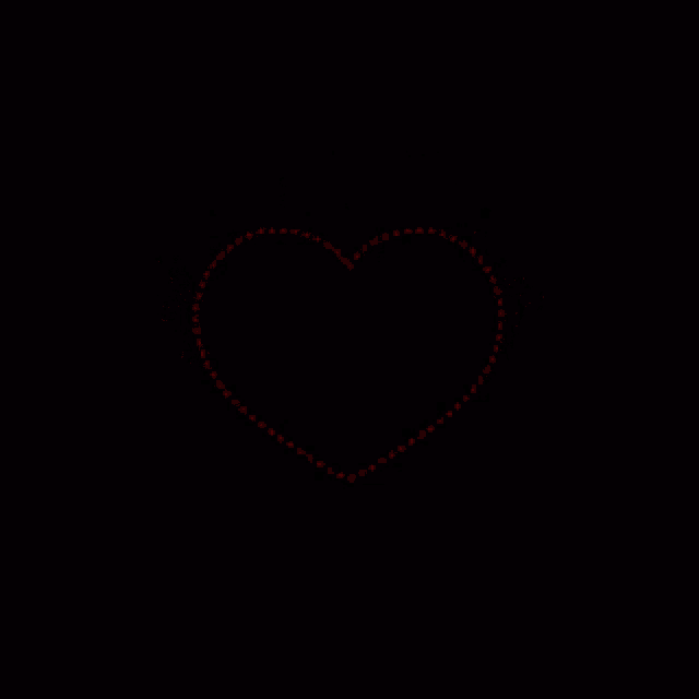 a black background with a circle of red dots