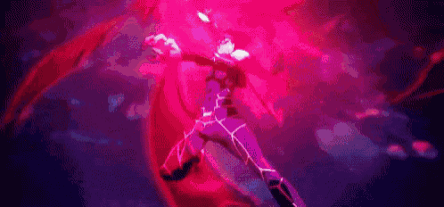 a man is standing in a dark room with a red light coming out of his hands .