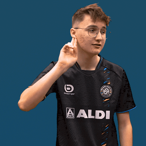 a young man wearing a black shirt with aldi on it