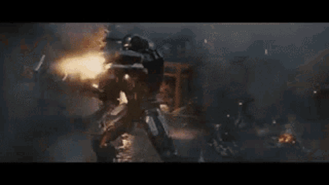 a group of soldiers are fighting each other in a battle scene from avengers : endgame .