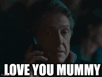 a man talking on a cell phone with the words " love you mummy " above him