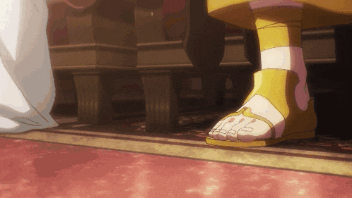 a close up of a person 's feet in sandals