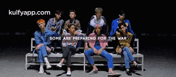 a group of people sitting on a bench with the words " some are preparing for the war " on the bottom