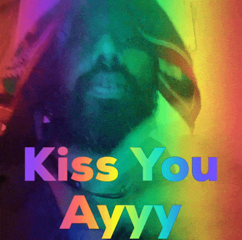 a man with a beard says kiss you ayy