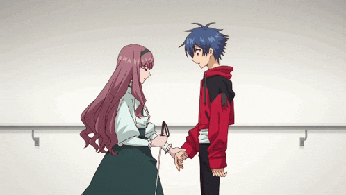 a boy and a girl are holding hands in a dance studio