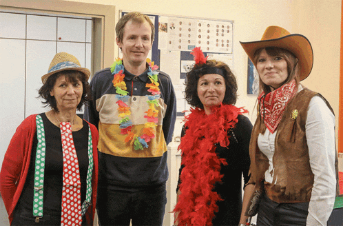 a group of people are dressed up in costumes including a man in a cowboy hat