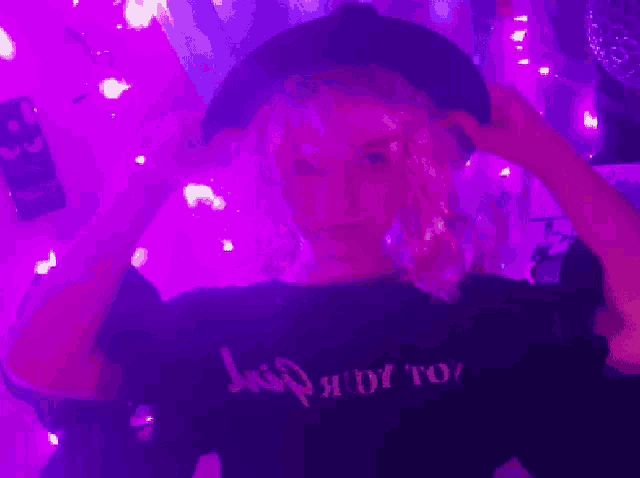 a girl wearing a hat and a shirt that says ready to
