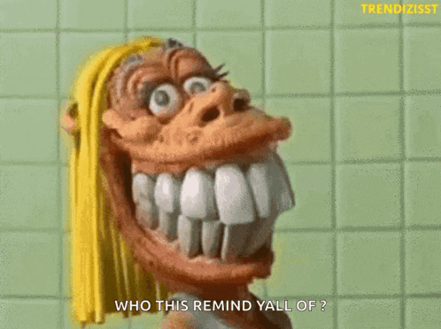 a cartoon character with a big smile on his face and the words who this remind yall of