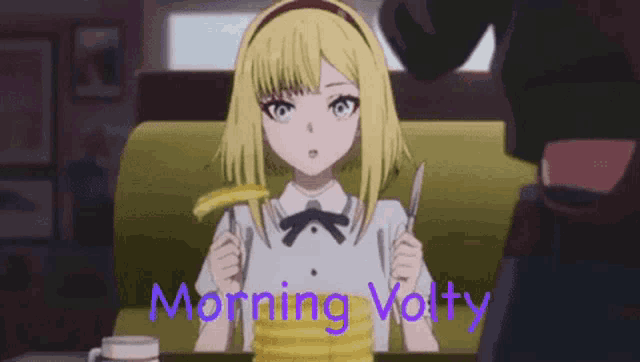 a girl is sitting at a table with a knife and fork .
