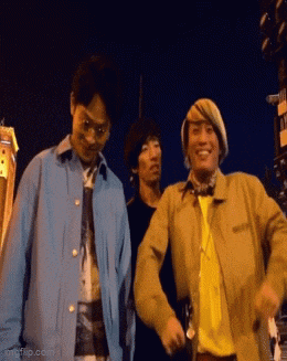 a group of men are standing next to each other and smiling