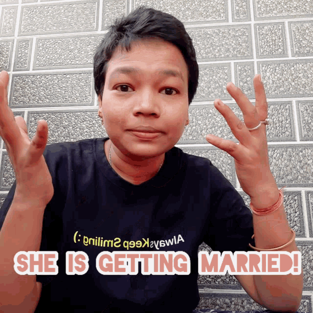a woman wearing a black shirt that says she is getting married on it