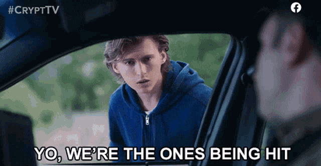 a man in a blue hoodie says " yo we 're the ones being hit " in a car