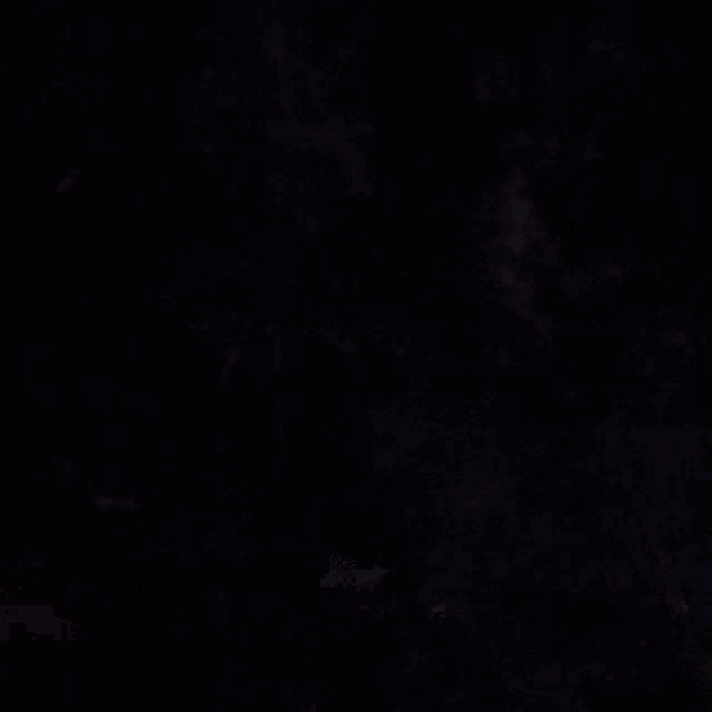 a dark background with a few lines and a blue glowing object