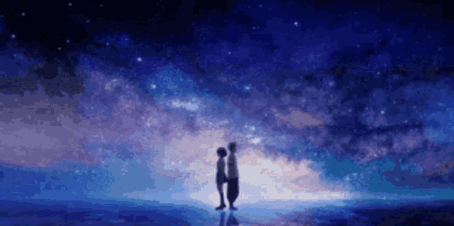 a couple of people are standing next to each other under a starry sky .