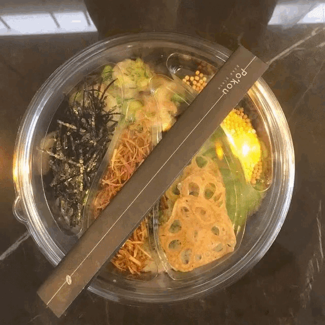 a bowl of food with a paper that says " poyou " on it