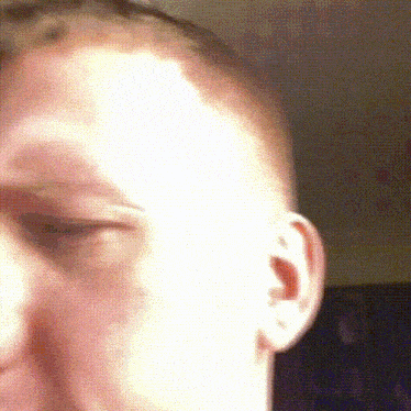 a close up of a man 's face and ear
