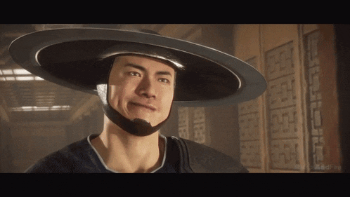 a man wearing a hat with a helmet on his head