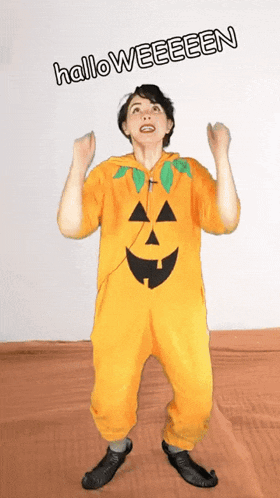 a person in a pumpkin costume with the words halloweeeen below them