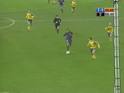 a soccer game is being played with the score 2-0