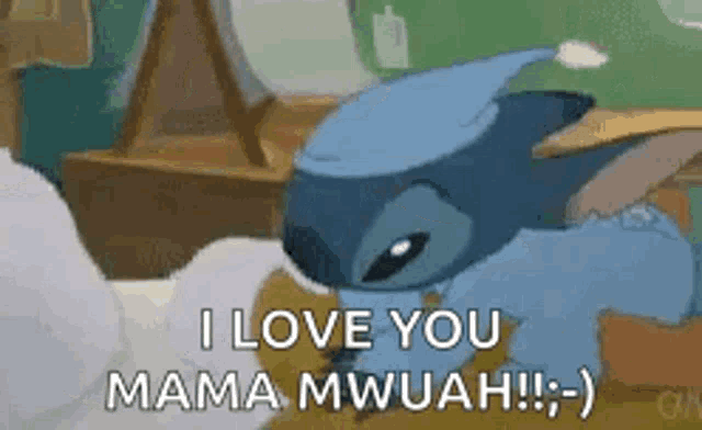 a cartoon character is laying on a bed with the words `` i love you mama mwuah '' written on it .