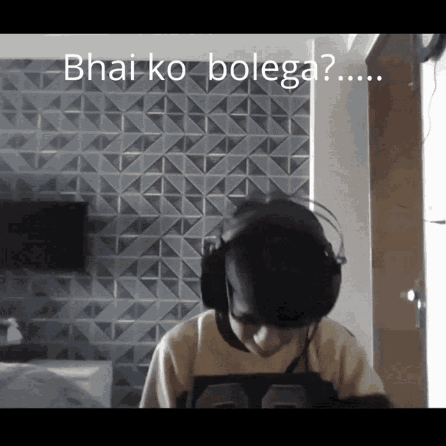 a man wearing headphones with the words " bhai ko bolega " written above him