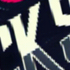 a close up of a black and white graphic with the letter v on it