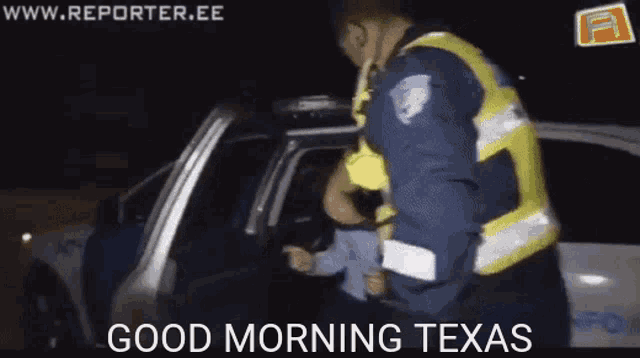 a police officer says good morning texas in front of a police vehicle