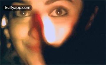 a close up of a woman 's face with the words kulfyapp.com written on the bottom .
