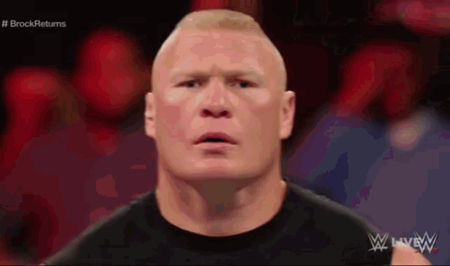 a close up of a man 's face with the words brock returns on the bottom right