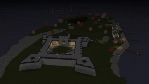 an aerial view of a castle at night with a light shining on it