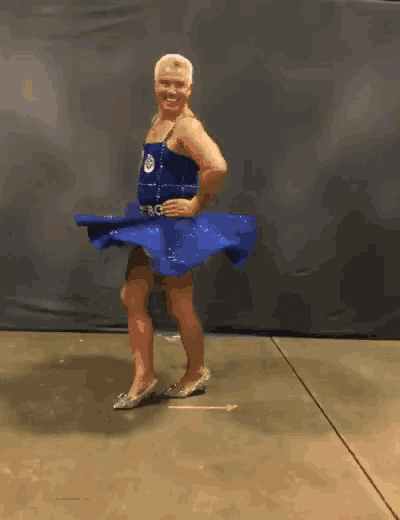 a man in a blue dress with the number 10 on the front