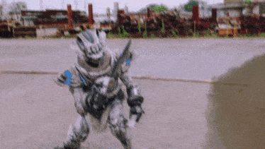 a robot with a sword and a helmet is walking on a road