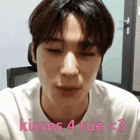 a close up of a man 's face with the words kisses 4 rue < 3 written on the bottom