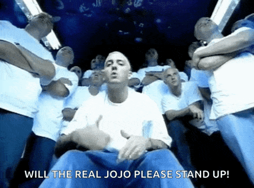 a group of men are standing around a man with the words will the real jojo please stand up on the bottom