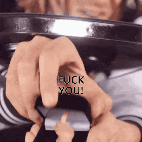 a close up of a person 's hands with the words " fuck you " on the bottom
