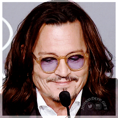 a close up of a man wearing glasses and a microphone with johnny depp gifs written on the bottom
